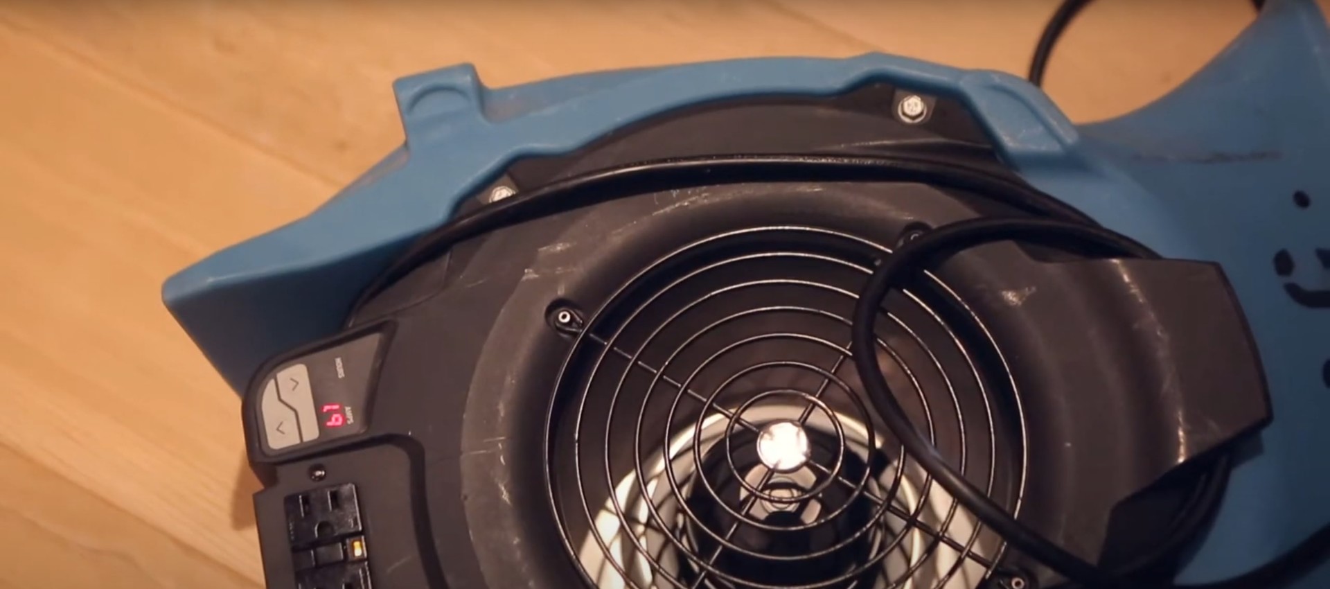 Industrial water damage restoration equipment in use Professional water damage restoration equipment including industrial fans and air movers